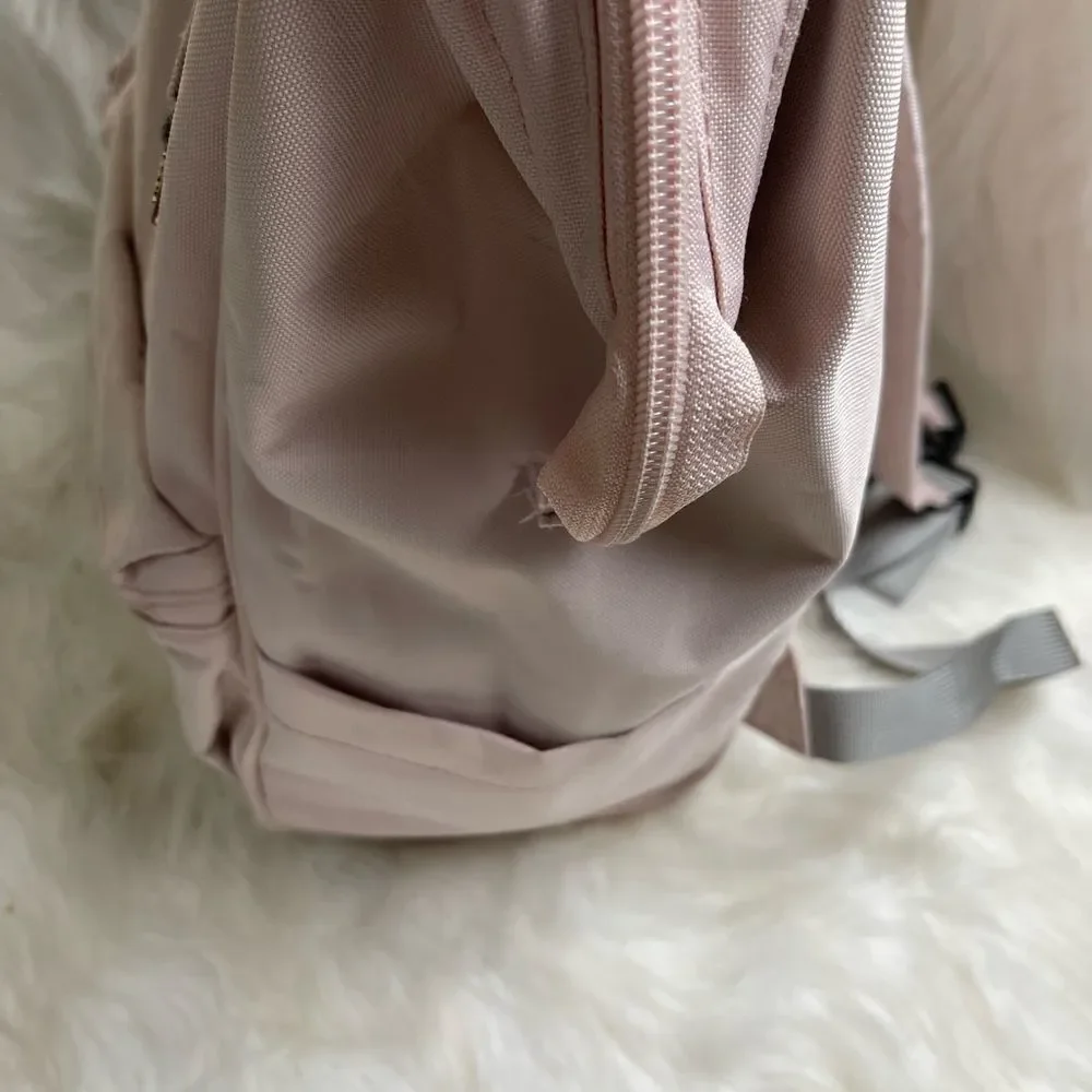 Swiss Gear light pink canvas multi purpose backpack with Rose gold Hardw…
